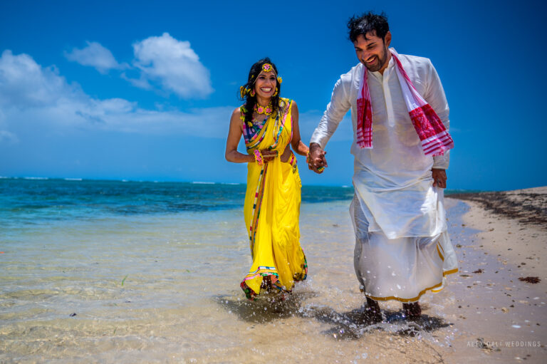 Indian wedding couple getting married at the beach during haldi ceremony at Hyatt Grand Reserve in San Juan