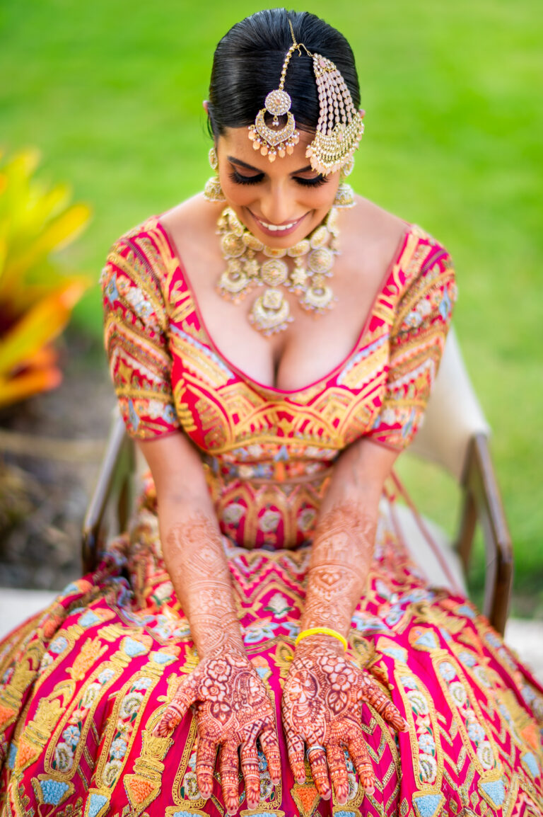 Indian bride showcasing her jewelry and henna during an Indian wedding celebration at Hyatt Grand Reserve in San Juan