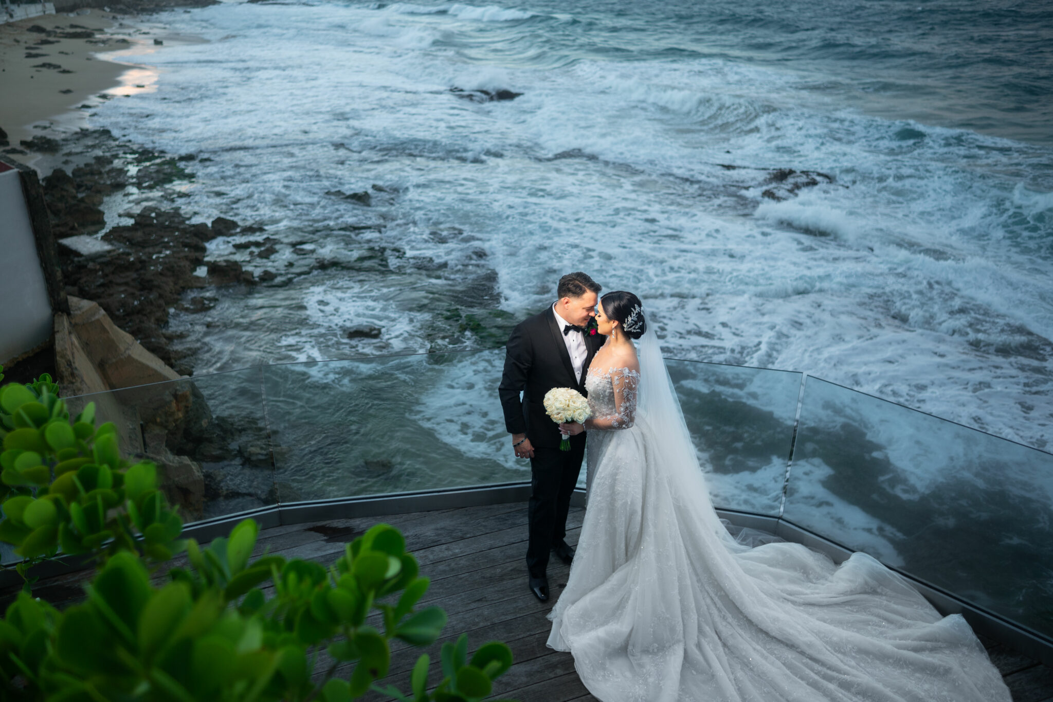 Wedding couple standing in front of the beautiful bay area of Condado Vanderbilt