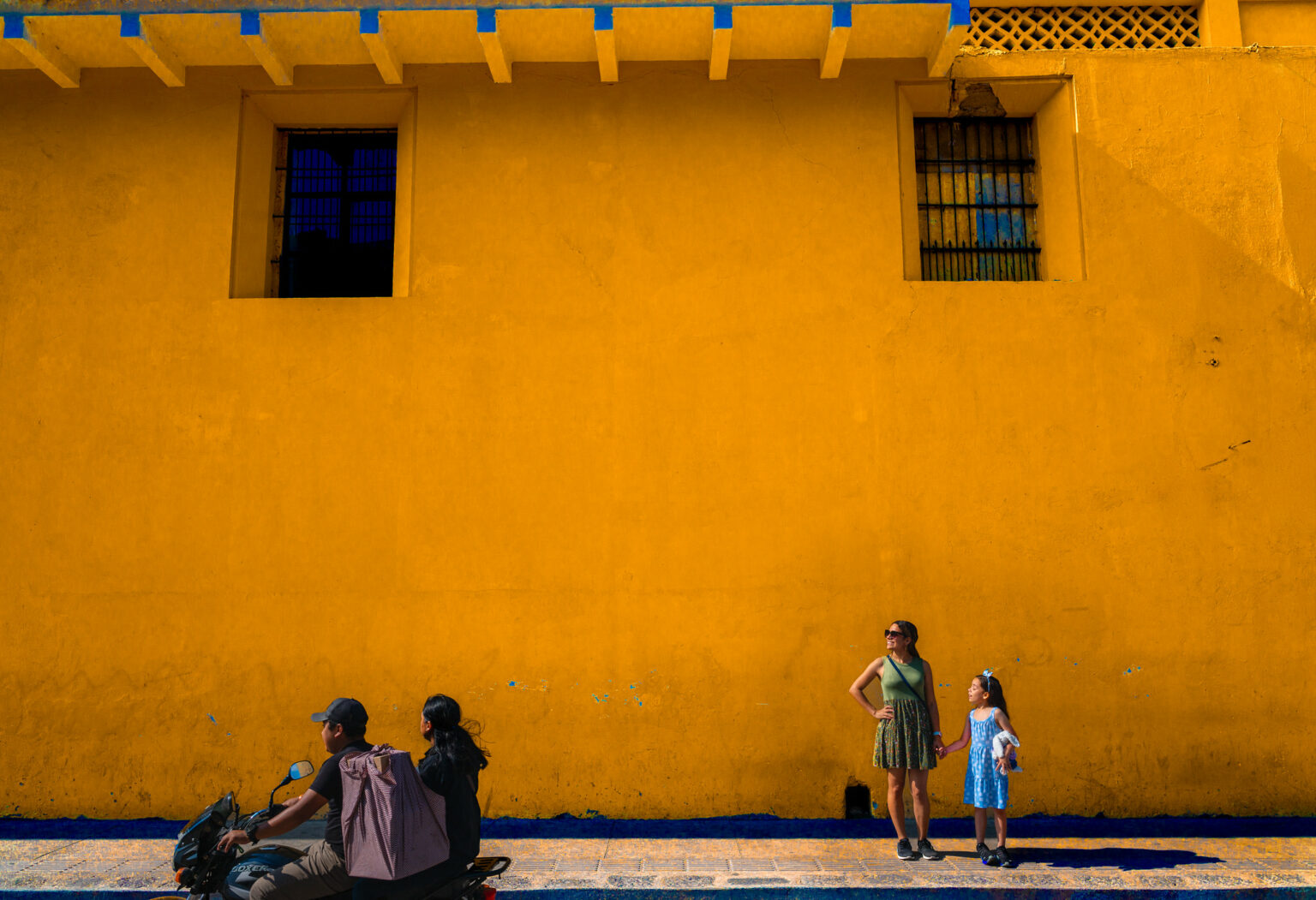 A family of travelers wandering about Antigua Guatemala.